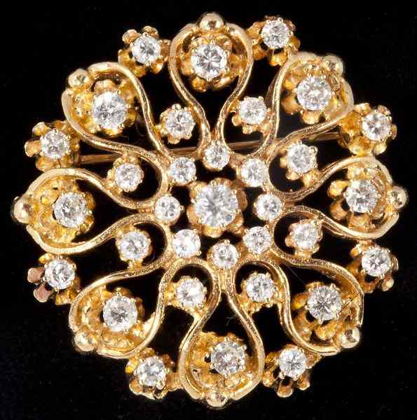 Appraisal: Gold and Diamond Snowflake Brooch Pendantdesigned of open scroll work