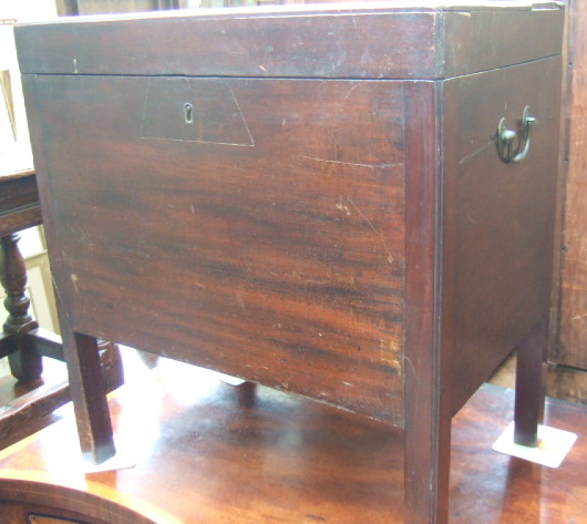 Appraisal: A George III rectangular mahogany wine cooler with a hinged