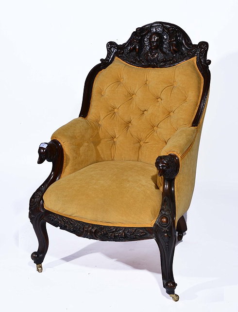 Appraisal: A VICTORIAN CARVED MAHOGANY AND UPHOLSTERED EASY CHAIR carved with