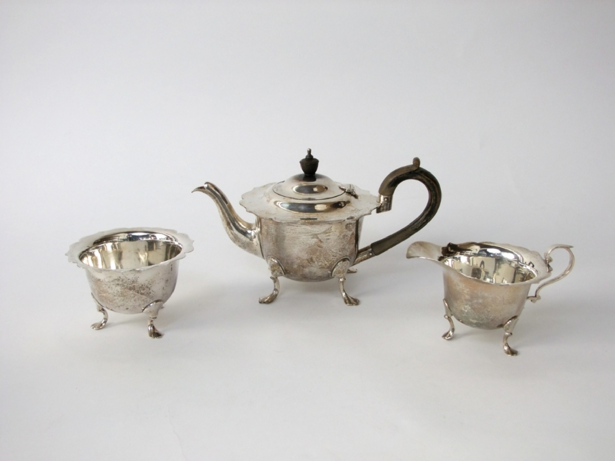 Appraisal: A three piece tea set each body of cylindrical form