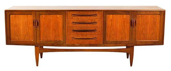 Appraisal: G-PLAN ENGLISH SIDEBOARD c s teak with four centre drawers