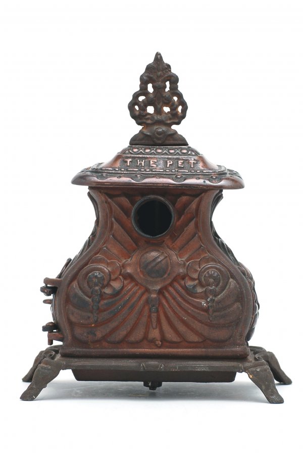 Appraisal: Toy parlor stove cast iron with ornate handle resting atop