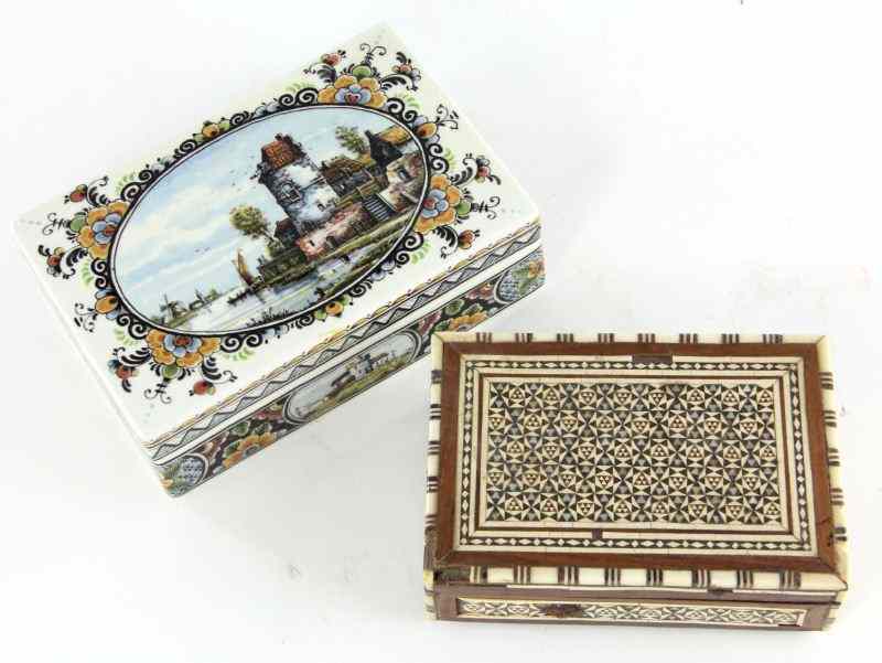 Appraisal: Two Dresser Boxesthe first a delftware box with landscape scenes