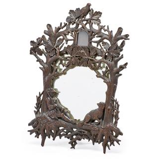 Appraisal: BLACK FOREST CARVED TABLETOP MIRROR Featuring a hunter and his