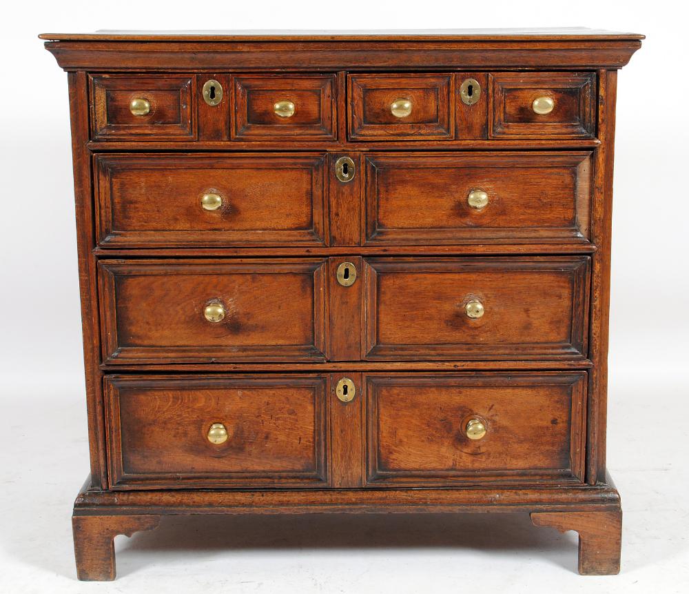 Appraisal: AN OAK GEOMETRICALLY MOULDED CHEST th century the moulded edged