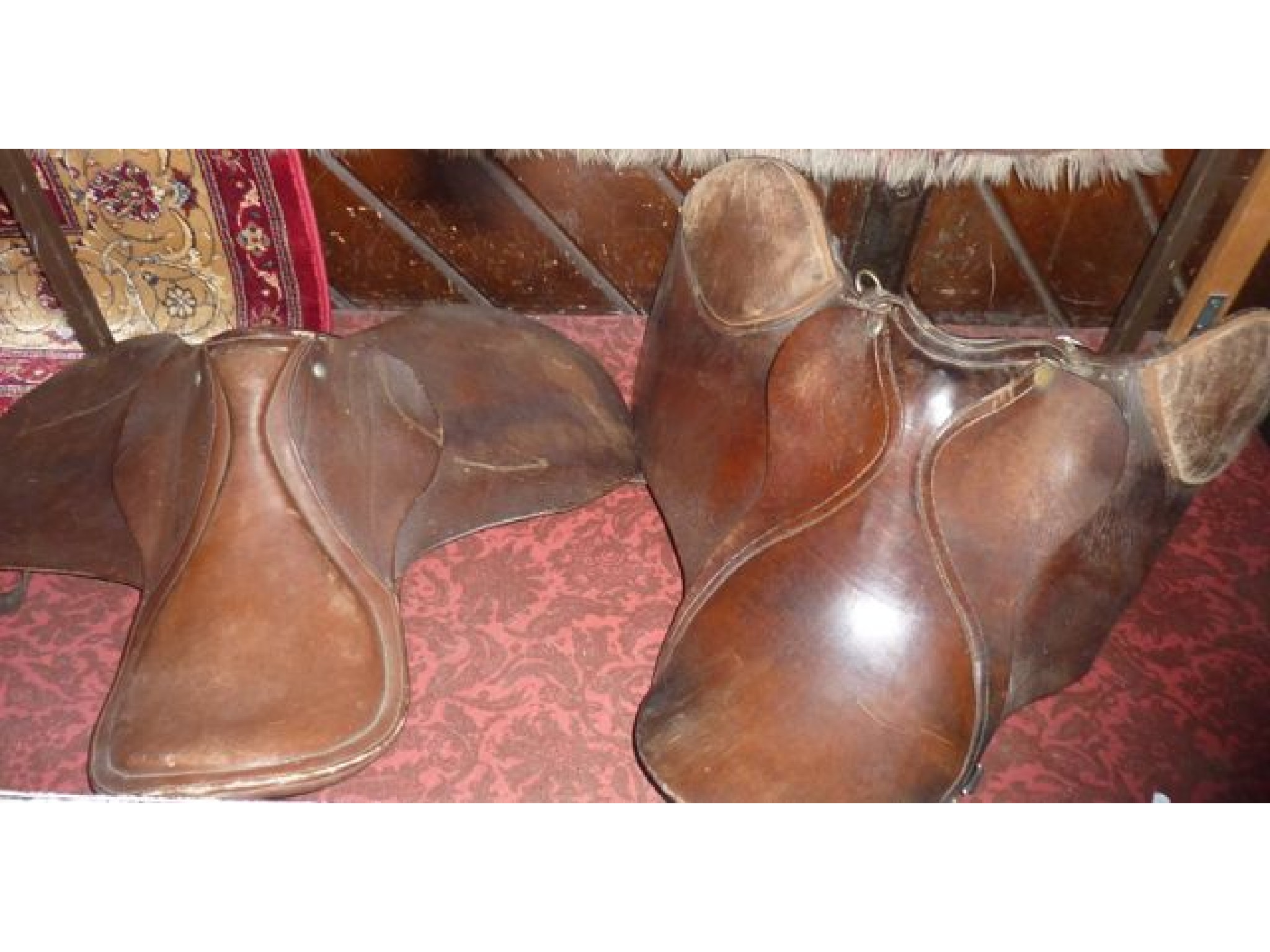 Appraisal: Two vintage leather saddles