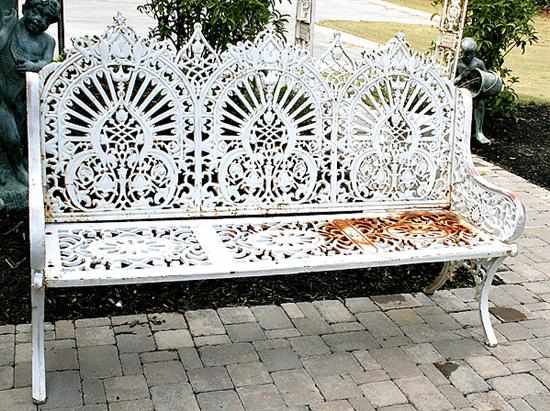 Appraisal: Painted cast-iron garden bench back composed of three splats with