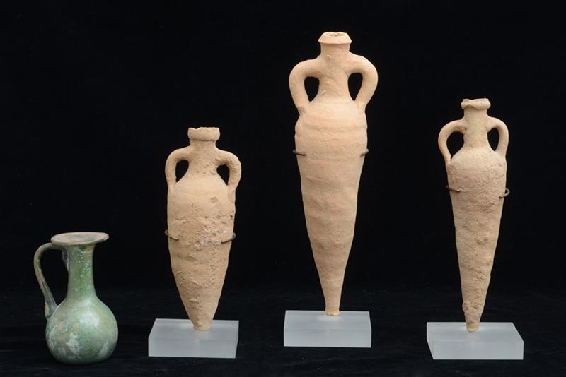 Appraisal: THREE ANCIENT TERRACOTTA VIALS AND A GLASS VESSEL The three