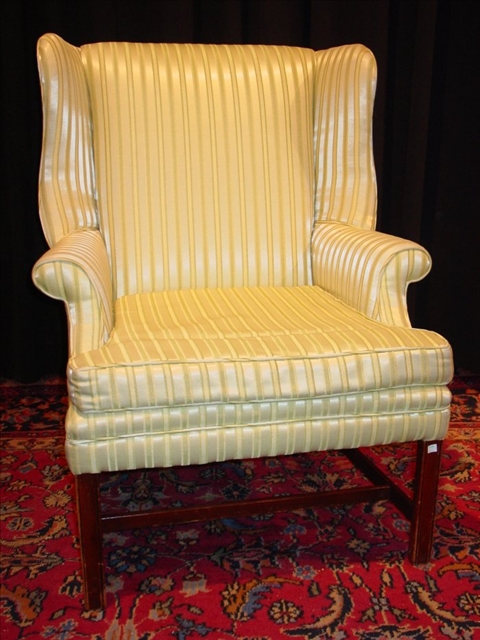 Appraisal: CHIPPENDALE STYLE UPHOLSTERED WING CHAIR th c with green striped