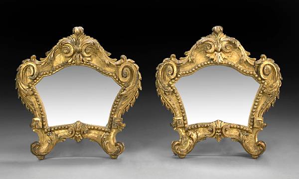 Appraisal: A pair of Italian Baroque style carved giltwood mirrors th