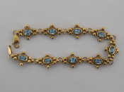 Appraisal: A carat gold and blue topaz bracelet each of the