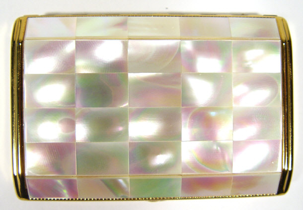 Appraisal: Melissa gilt metal and faux mother of pearl compact with