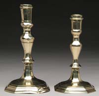 Appraisal: TWO ENGLISH BRASS QUEEN ANNE CANDLESTICKS Each having octagonal faceted