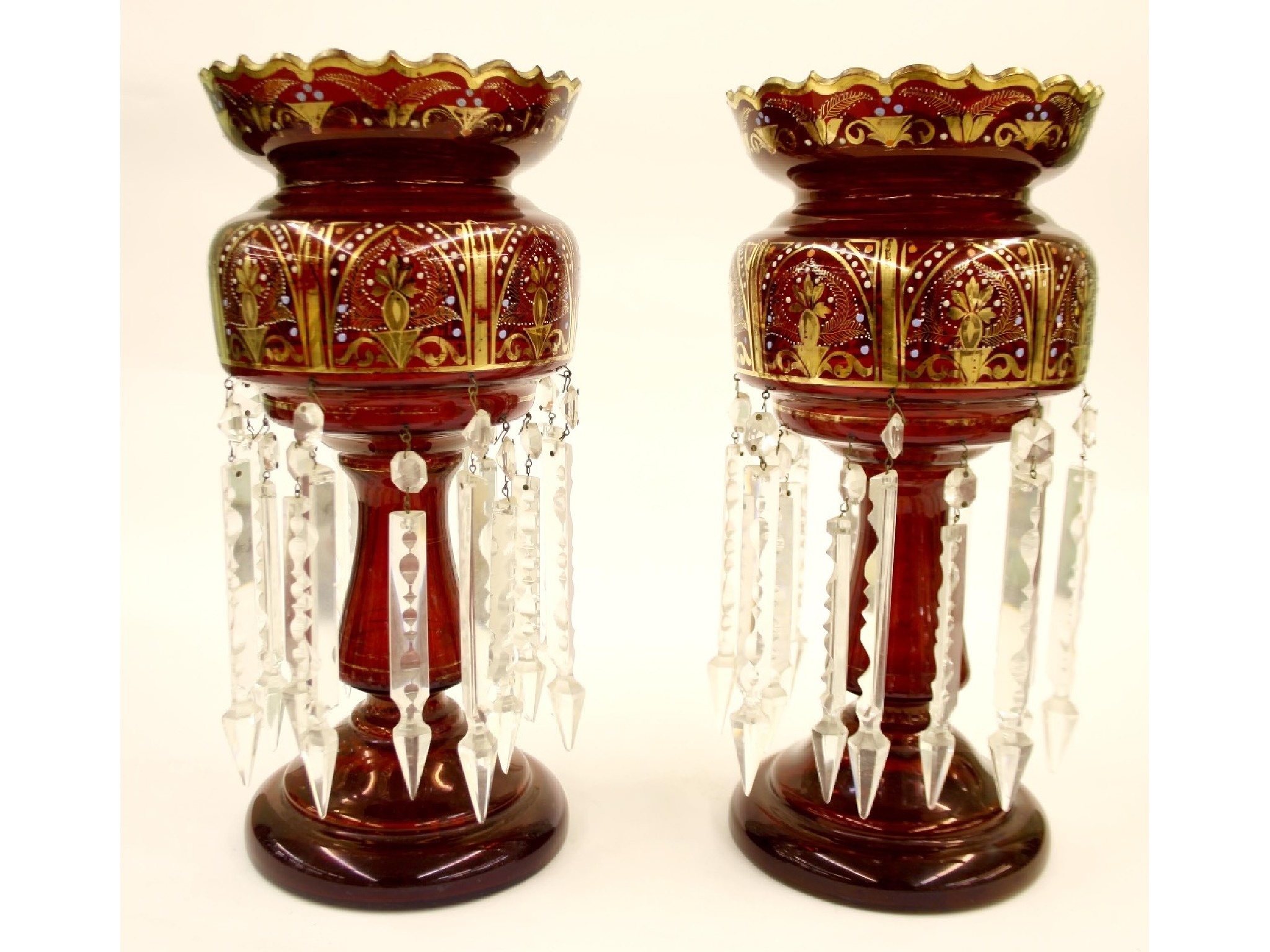 Appraisal: Good pair of Victorian cranberry glass lustres with gilded and