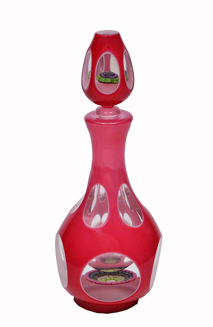 Appraisal: A MURANO OVERLAID PINK GLASS BOTTLE with facet cut decoration