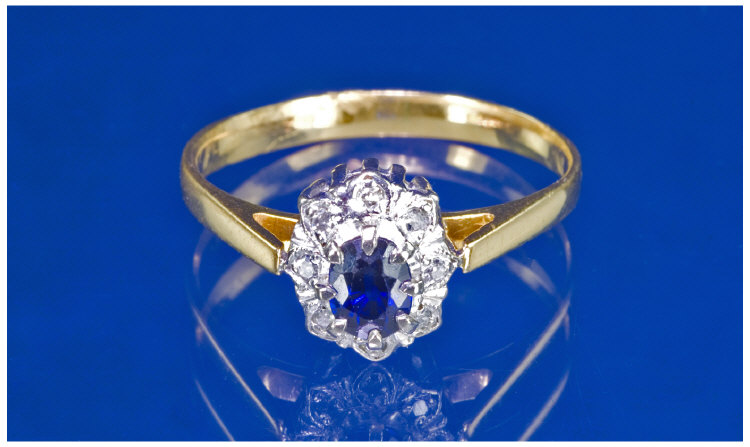 Appraisal: ct Gold Sapphire And Diamond Cluster Ring Central Sapphire Surrounded