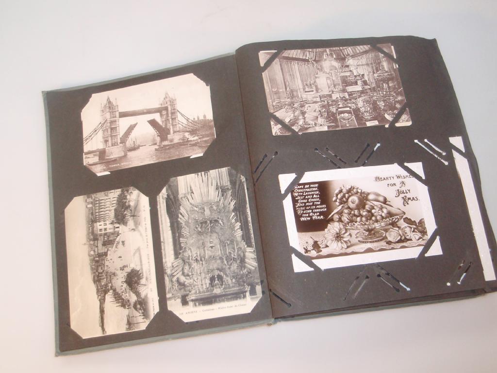 Appraisal: A postcard album and a collection of mainly topographical postcards