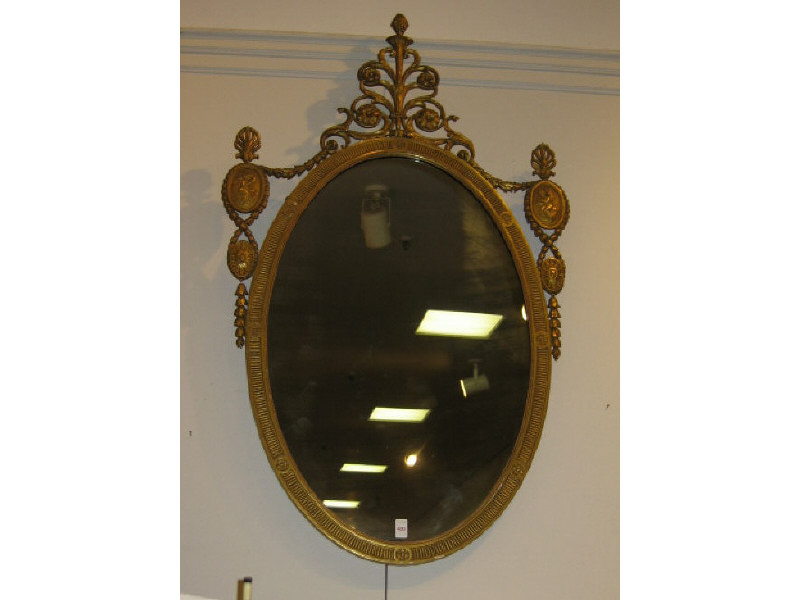 Appraisal: CONTINENTAL GILTWOOD AND GESSO WALL MIRROR Elaborate scrolling foliate crest