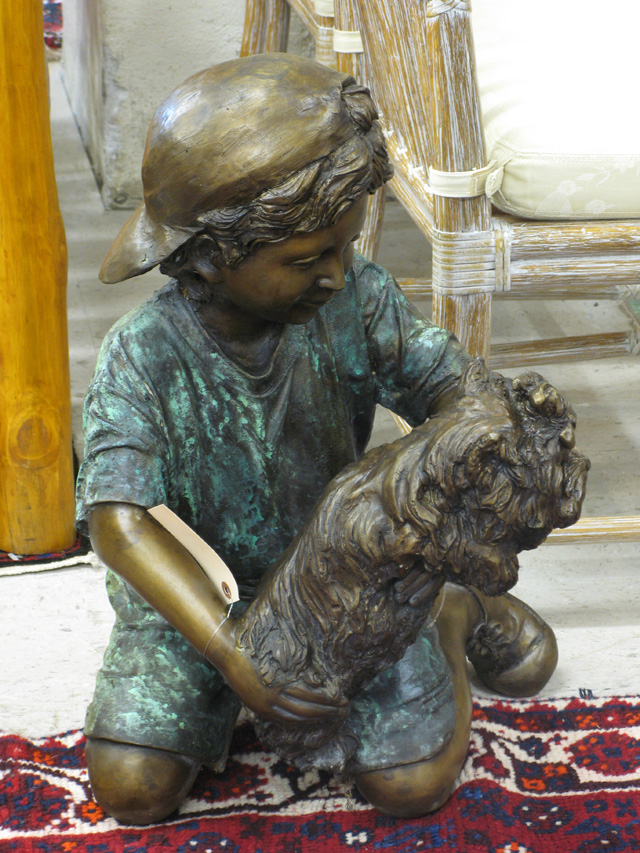 Appraisal: PATINATED BRONZE SCULPTURE kneeling boy with puppy golden brown and