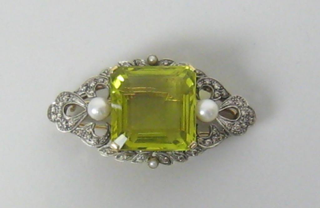 Appraisal: A Peridot Pearl and Diamond Brooch the large step-cut peridot