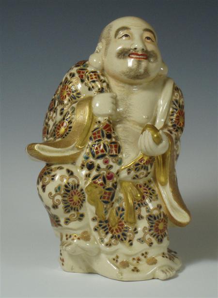 Appraisal: An early th century Satsuma figure of a man carrying