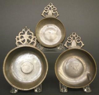 Appraisal: Pewter porringers Three early th century Pewter porringers Having Old