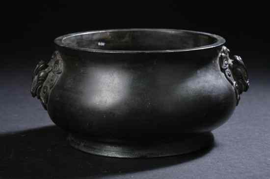 Appraisal: CHINESE BRONZE CENSER Bomb -form body flanked by two handles