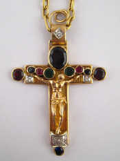 Appraisal: A yellow metal tests carat gold gem set crucifix pendant