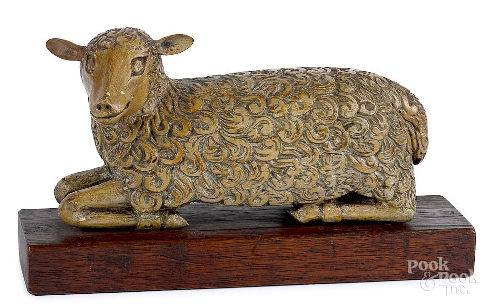 Appraisal: Carved and painted reclining lamb Carved and painted reclining lamb