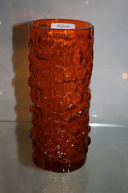 Appraisal: A GLASS WHITEFRIARS STYLE ORANGE VASE and a glass jug