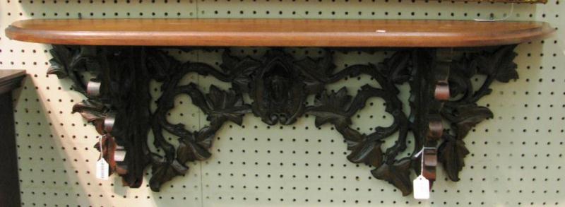 Appraisal: Victorian walnut clock shelf reticulated and carved with leaf and