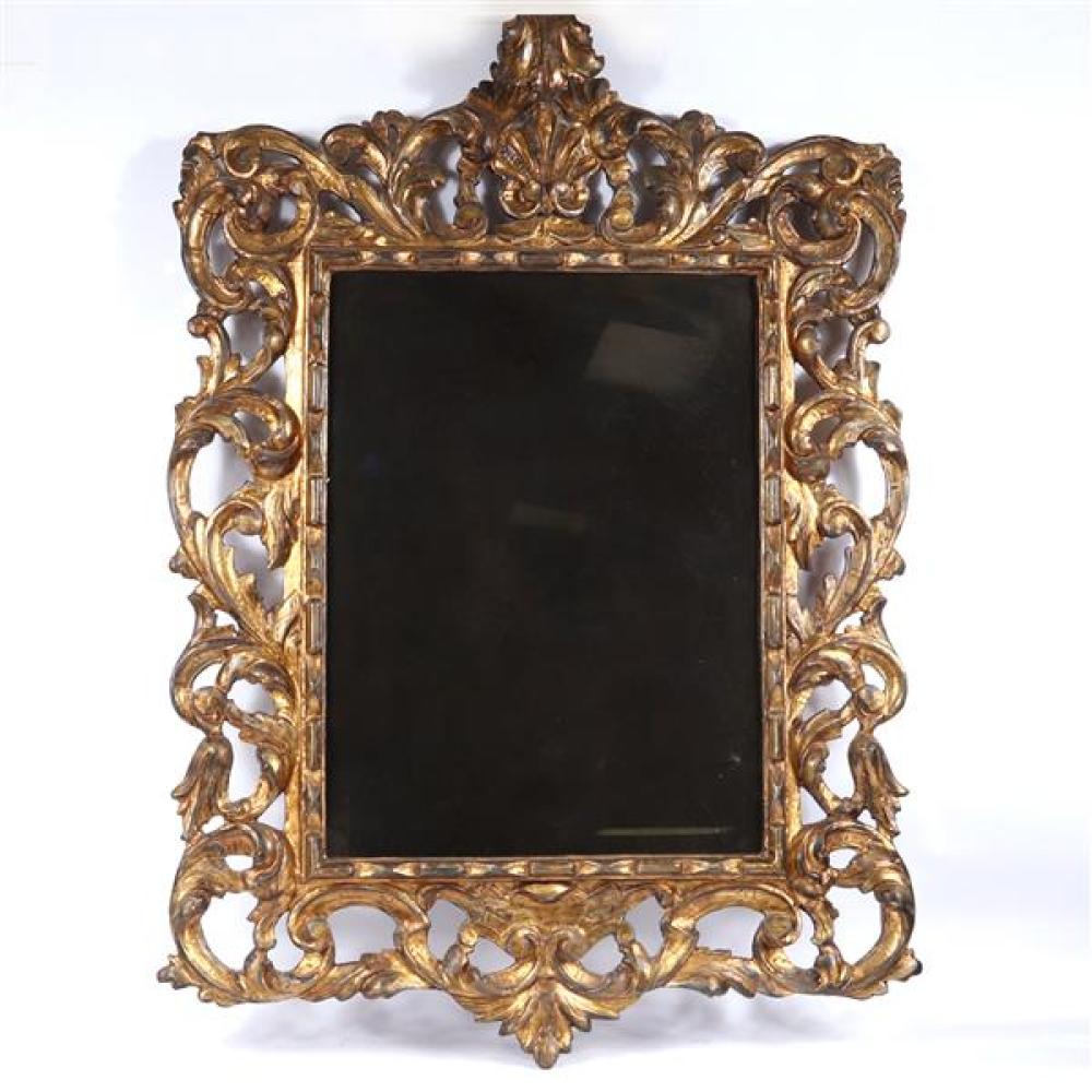 Appraisal: A ROCOCO STYLE CARVED AND GILT WOOD MIRROR A Rococo