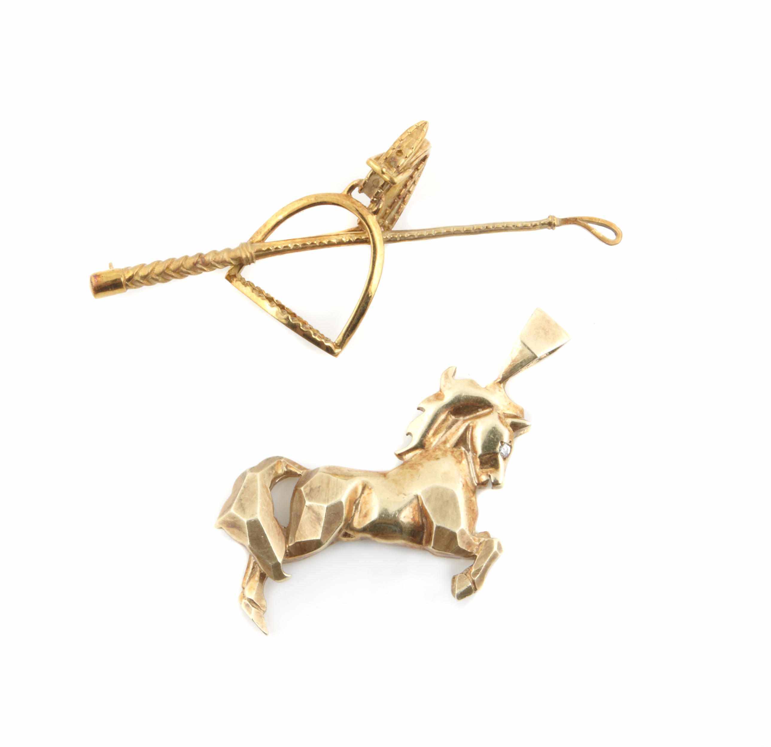 Appraisal: Two k gold equestrian motif pendants g gross