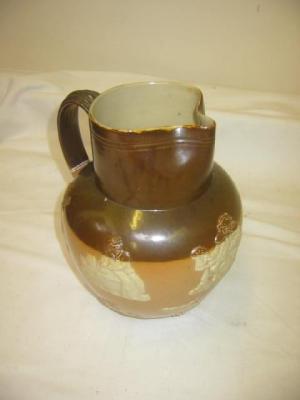 Appraisal: A ROYAL DOULTON STONEWARE JUG of baluster form with reeded