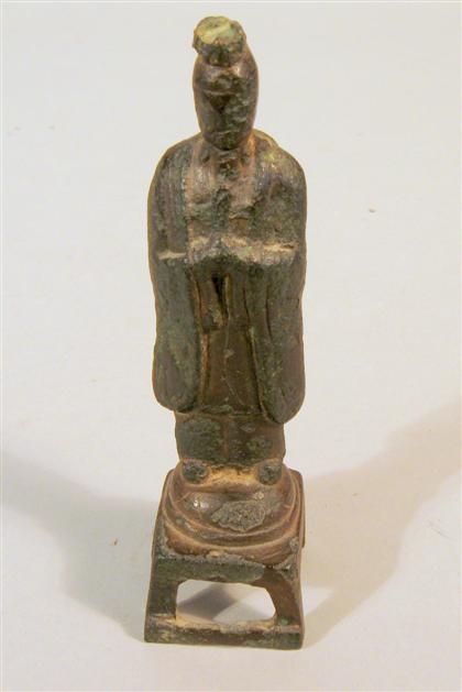 Appraisal: Small Chinese bronze figure Tang dynasty Depicting a standing male