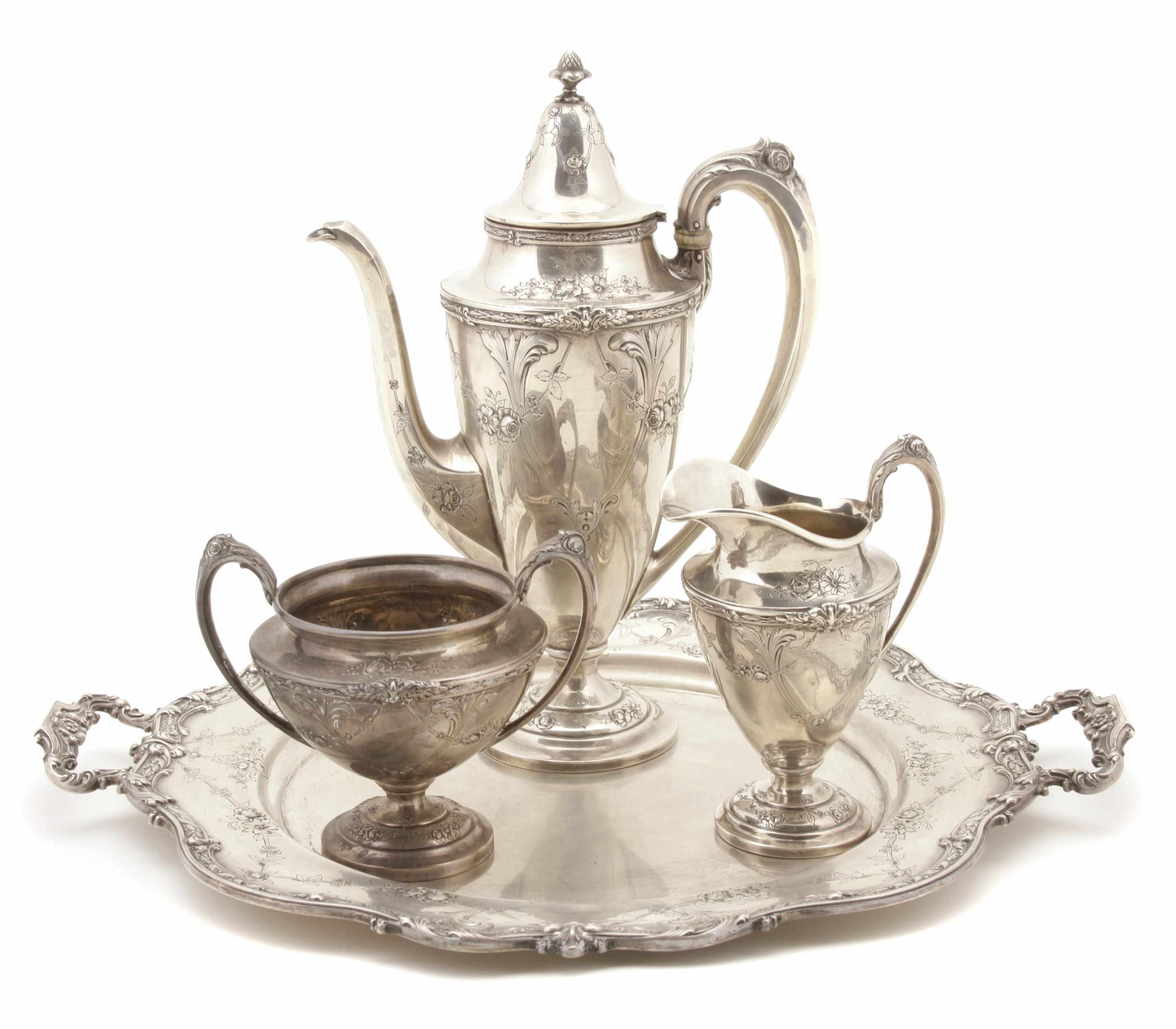 Appraisal: An American sterling silver three piece coffee service with matching