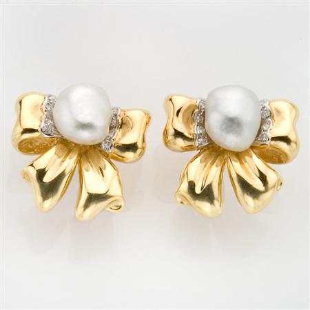 Appraisal: Pair of Gold and Baroque Cultured Pearl Bow Earclips Estimate