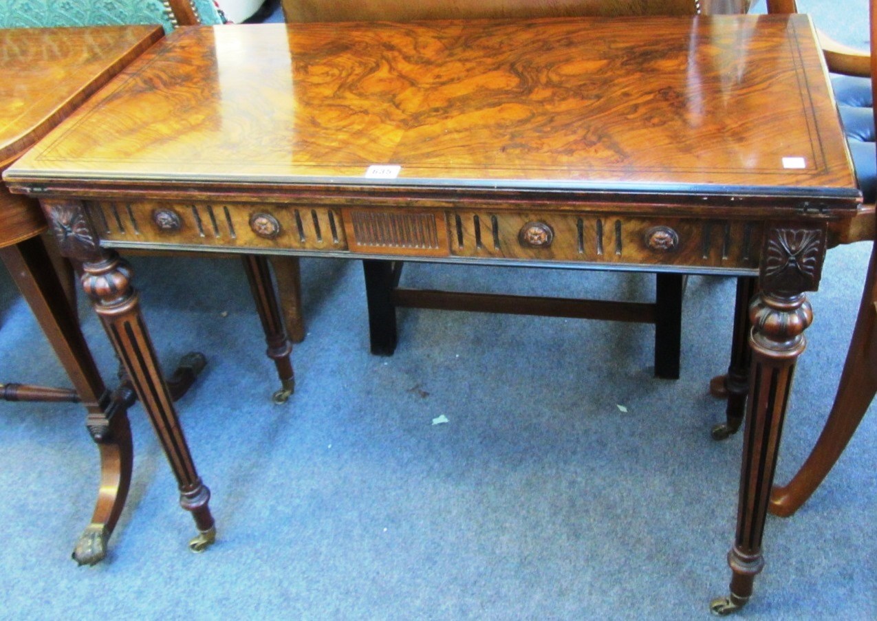 Appraisal: A th century figured walnut rectangular card table on tapering