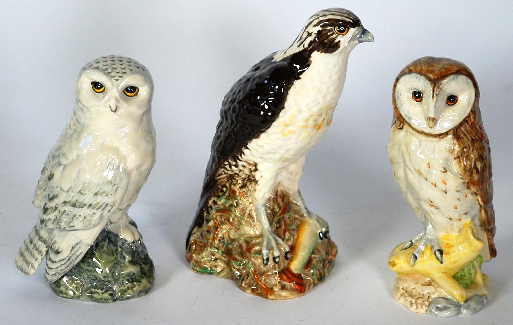 Appraisal: THREE ROYAL DOULTON BIRD PATTERN POTTERY WHISKY FLAGONS produced for