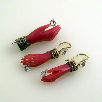 Appraisal: A Victorian pair of carved coral hand earrings Each drop