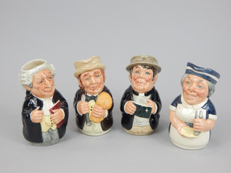 Appraisal: A set of four Royal Doulton character jugs the Doultonville