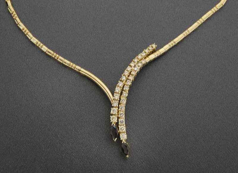 Appraisal: K gold diamond and sapphire necklace having round brilliant cut