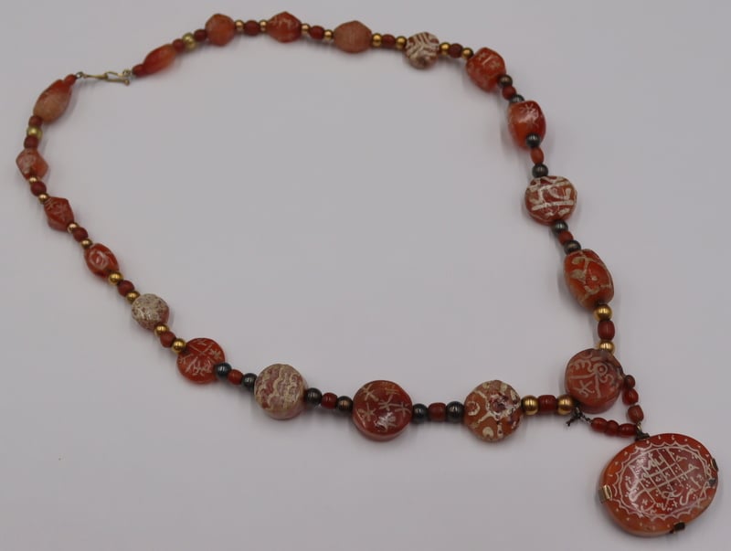 Appraisal: JEWELRY ISLAMIC ENGRAVED AGATE AQEEQ NECKLACE Islamic agate necklace comprised