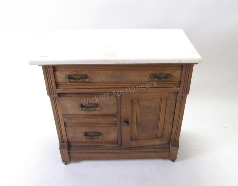 Appraisal: An antique walnut washstand circa with white marble top three