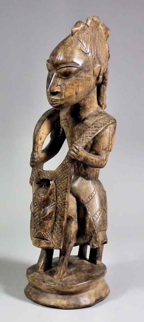 Appraisal: A Yoruba Fetish Figure Nigeria - Carve hardwood and light