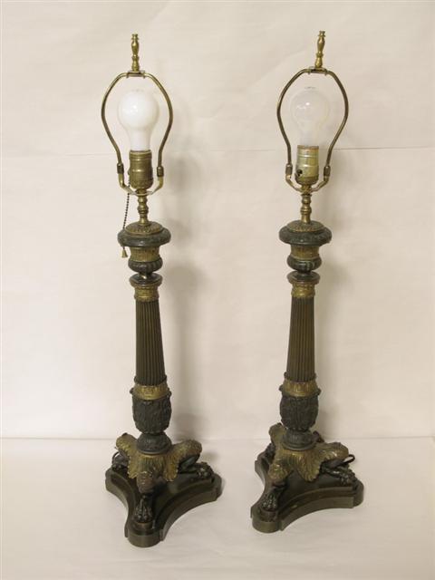 Appraisal: PAIR OF FRENCH BRONZE CANDLESTICKS LAMPS in the Restauration style