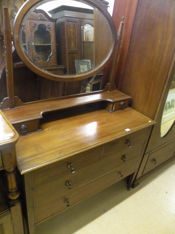 Appraisal: An Edwardian mahogany chequer banded dressing table with two short