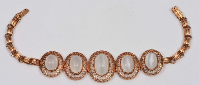 Appraisal: Stylised braceletwith five moonstone setting with pierced decoration stamped k