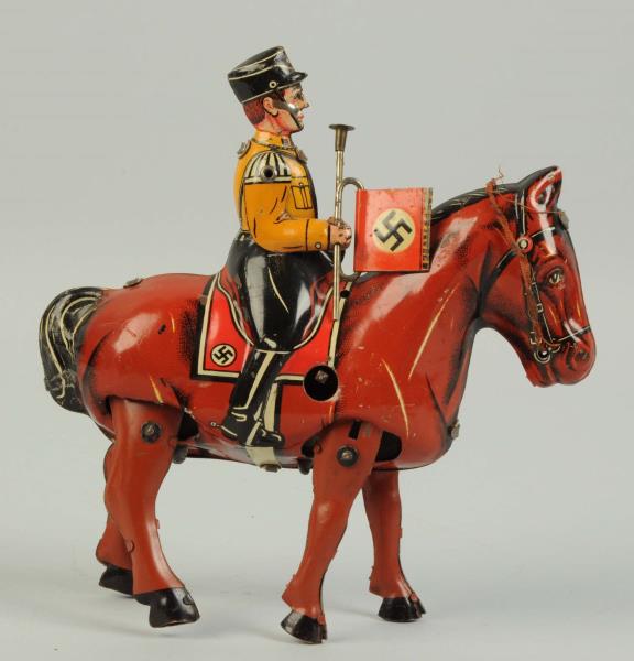 Appraisal: German Tin Litho Wind-Up Military Figure On Horse Usually seen