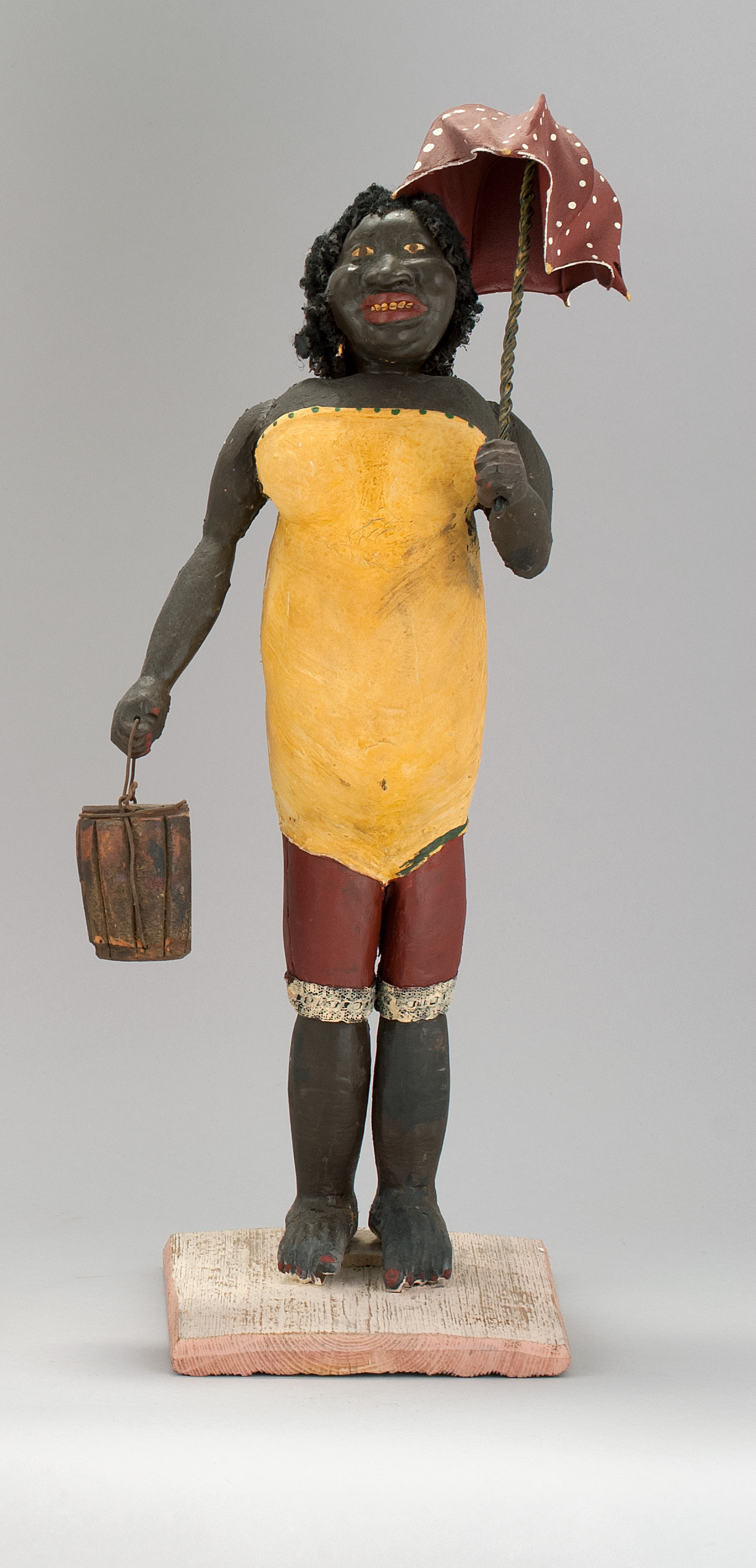 Appraisal: WHIMSICAL COMPOSITION AND WOOD FIGURE OF AN AFRICAN AMERICAN WOMAN